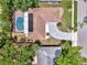 Aerial view of a beautiful property with a pool, solar panels, and a spacious driveway at 2924 Valley Forge St, Sarasota, FL 34231