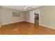 Bedroom featuring hardwood floors, neutral paint, a ceiling fan, and an open doorway at 2924 Valley Forge St, Sarasota, FL 34231