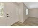 Bright foyer showcasing a stylish front door and wood-look flooring at 2924 Valley Forge St, Sarasota, FL 34231