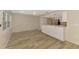 Open kitchen with white cabinetry, long countertops and stainless steel appliances at 2924 Valley Forge St, Sarasota, FL 34231