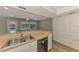 Kitchen stainless steel sink and dishwasher with open living concept at 2924 Valley Forge St, Sarasota, FL 34231