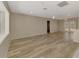 Bright and spacious living room featuring tile floors, neutral walls, and French doors at 2924 Valley Forge St, Sarasota, FL 34231