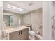 Comfortable bathroom with a vanity and a toilet and a walk-in shower at 3030 Grand Bay Blvd # 323, Longboat Key, FL 34228