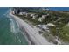Stunning coastal views with a wide sandy beach, luxurious condos, and meticulously landscaped grounds at 3030 Grand Bay Blvd # 323, Longboat Key, FL 34228