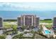 A luxurious residence with lush landscaping, sparkling pools, and breathtaking ocean views at 3030 Grand Bay Blvd # 323, Longboat Key, FL 34228
