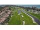 Scenic aerial view of a lush golf course with waterfront homes and ocean views in a beautiful community at 3030 Grand Bay Blvd # 323, Longboat Key, FL 34228