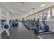 Bright gym featuring modern equipment, mirrored walls, and large windows with beautiful outside views at 3030 Grand Bay Blvd # 323, Longboat Key, FL 34228