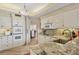 Modern kitchen featuring white cabinetry, granite countertops, and stainless steel appliances at 3030 Grand Bay Blvd # 323, Longboat Key, FL 34228