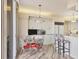 Eat-in kitchen featuring white cabinets, granite countertops and breakfast bar at 3030 Grand Bay Blvd # 323, Longboat Key, FL 34228