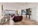 Open-concept living room with wood floors, ocean views, and modern furnishings at 3030 Grand Bay Blvd # 323, Longboat Key, FL 34228