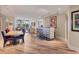 Open living room with hardwood floors, bar seating, and an open floor plan at 3030 Grand Bay Blvd # 323, Longboat Key, FL 34228