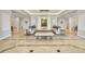 Inviting lobby with stylish seating, elegant lighting, and polished marble floors at 3030 Grand Bay Blvd # 323, Longboat Key, FL 34228