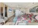 Comfortable main bedroom with a view, desk, ceiling fan, and lots of closet storage at 3030 Grand Bay Blvd # 323, Longboat Key, FL 34228