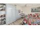 Large main bedroom with a desk, built-in storage, lots of light, and neutral colors at 3030 Grand Bay Blvd # 323, Longboat Key, FL 34228
