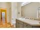 Bathroom with tile flooring, vanity, toilet, and linen closet, offering functionality and storage space at 361 Whitfield Ave, Sarasota, FL 34243