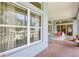 Relaxing screened patio offers beautiful views of the spacious backyard and lots of natural light at 361 Whitfield Ave, Sarasota, FL 34243