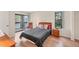 Inviting bedroom with a private balcony, wood floors, comfortable seating, and ample natural light at 4017 Crockers Lake Blvd # 1421, Sarasota, FL 34238