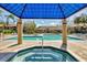 Resort-style community pool and hot tub with covered pavilion and deck chairs for relaxing afternoons in the sun at 4017 Crockers Lake Blvd # 1421, Sarasota, FL 34238