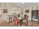 Cozy dining area with a glass table and kitchen counter seating, perfect for casual meals and entertaining at 4017 Crockers Lake Blvd # 1421, Sarasota, FL 34238