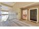 Inviting condo entrance with a wood porch, leading into a bright, airy space with views of the dining area at 4017 Crockers Lake Blvd # 1421, Sarasota, FL 34238