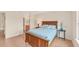 Tranquil bedroom with a wooden bed frame and soothing blue accents, creating a relaxing retreat at 4017 Crockers Lake Blvd # 1421, Sarasota, FL 34238
