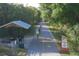 View along the Legacy Trail showing the Osprey Junction Station and bicyclists along the paved path at 4017 Crockers Lake Blvd # 1421, Sarasota, FL 34238