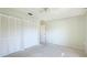 The bedroom features a spacious closet with a ceiling fan at 4172 Oakhurst W Cir, Sarasota, FL 34233