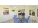 This sunny breakfast nook boasts backyard views and overlooks the kitchen and office at 4172 Oakhurst W Cir, Sarasota, FL 34233