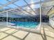 Community pool featuring covered area with ample seating and clear blue water at 4172 Oakhurst W Cir, Sarasota, FL 34233