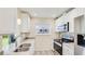 This kitchen features stainless steel appliances, modern hardware, and a window over the sink at 4172 Oakhurst W Cir, Sarasota, FL 34233