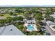 Aerial view of community pool and hot tub surrounded by lush landscaping and residences at 4210 Caddie E Dr # 201, Bradenton, FL 34203