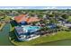Aerial view showcasing a clubhouse with a pool, dining area, and well-maintained landscaping at 4210 Caddie E Dr # 201, Bradenton, FL 34203