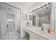 Bright bathroom featuring a vanity with a sink, mirror, and a glass-enclosed shower, all in a clean, neutral color palette at 4210 Caddie E Dr # 201, Bradenton, FL 34203