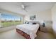 Inviting bedroom offering natural light, ceiling fan, carpet, and community views at 4210 Caddie E Dr # 201, Bradenton, FL 34203