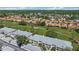 An aerial view of the community, featuring well-maintained condos and a lush green golf course at 4210 Caddie E Dr # 201, Bradenton, FL 34203