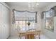 Cozy dining area featuring a charming table set by a bright window at 4210 Caddie E Dr # 201, Bradenton, FL 34203