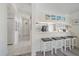 Bright kitchen with a breakfast bar featuring seating for four and modern appliances at 4210 Caddie E Dr # 201, Bradenton, FL 34203