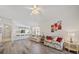 Bright living space with hardwood floors leading into the kitchen and dining area at 4210 Caddie E Dr # 201, Bradenton, FL 34203