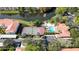 Aerial view of a community featuring a lake, pool, and tennis courts at 4264 Central Sarasota Pkwy # 125, Sarasota, FL 34238