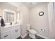 Updated bathroom featuring a modern vanity with white cabinets and an LED lighted mirror at 4264 Central Sarasota Pkwy # 125, Sarasota, FL 34238