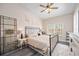Bright bedroom features a ceiling fan, dark wood floors, and ample natural light at 4264 Central Sarasota Pkwy # 125, Sarasota, FL 34238