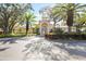 Beautiful clubhouse entrance with lush landscaping and ample parking at 4264 Central Sarasota Pkwy # 125, Sarasota, FL 34238