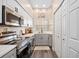Well-organized kitchen with stainless steel appliances, and granite countertops for meal preparation at 4264 Central Sarasota Pkwy # 125, Sarasota, FL 34238