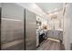 Well-lit kitchen with stainless steel appliances, gray cabinets and plenty of counter space at 4264 Central Sarasota Pkwy # 125, Sarasota, FL 34238
