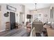 Inviting living room with a TV, fan and stylish decor, with an open view to the balcony at 4264 Central Sarasota Pkwy # 125, Sarasota, FL 34238