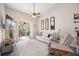 Bright living room with neutral tones, balcony access, a ceiling fan, and comfortable seating at 4264 Central Sarasota Pkwy # 125, Sarasota, FL 34238