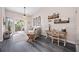 Cozy living room with a ceiling fan, desk area, and sliding doors to the balcony at 4264 Central Sarasota Pkwy # 125, Sarasota, FL 34238
