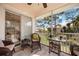 Inviting screened-in patio with comfortable seating and beautiful views of the surrounding landscape at 4264 Central Sarasota Pkwy # 125, Sarasota, FL 34238