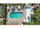 Beautiful community pool with lounge chairs and umbrellas, perfect for relaxation at 4264 Central Sarasota Pkwy # 125, Sarasota, FL 34238