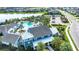 Aerial view of the community center with a luxurious pool, tennis courts, and community spaces at 4308 Fly Rod Ter, Parrish, FL 34219